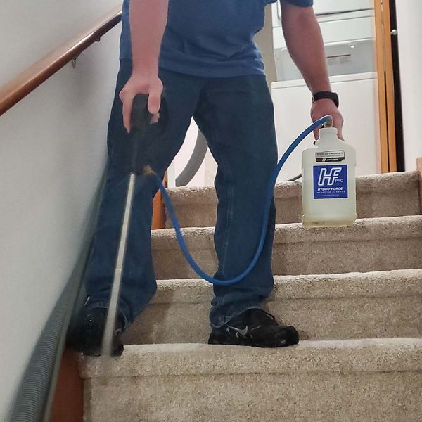 Man cleaning a stair case
