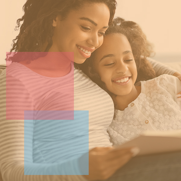 Mother reading with her teenage daughter