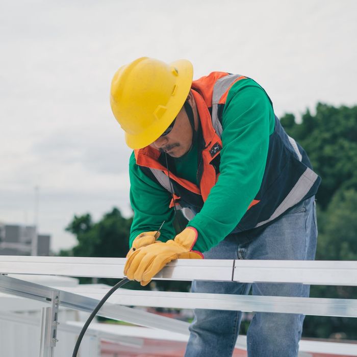 worker installing brackets 