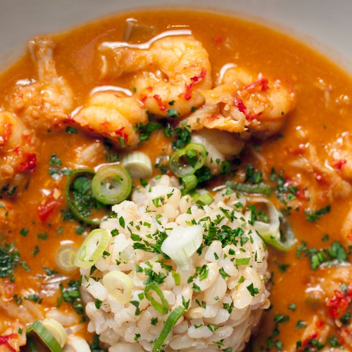 shrimp in a red sauce with rice