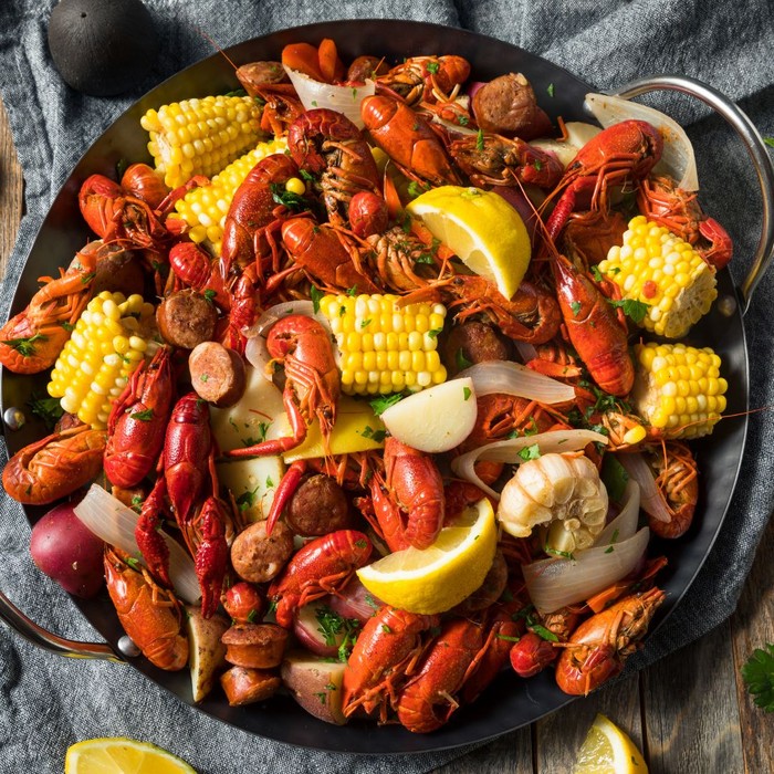 cooked crawfish with potatoes, corn, onion and seasoning