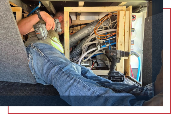 certified technician working on a RV furnace installation