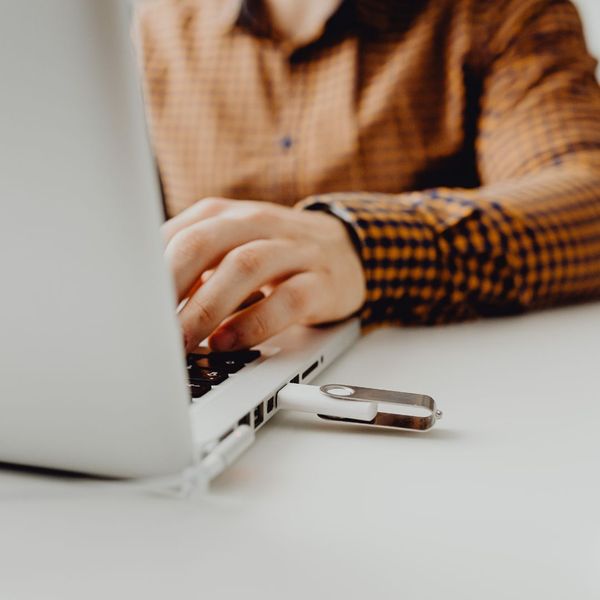 a flash drive plugged into a laptop