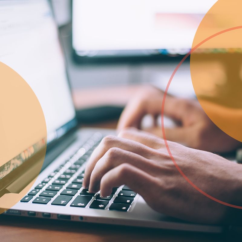 Person typing on laptop, organizing ideas