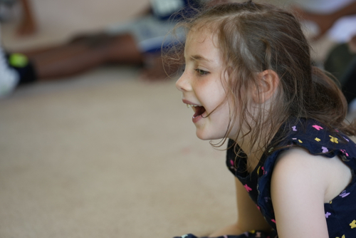 little girl smiling and laughing