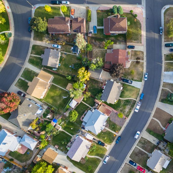 network of driveways and sidewalks in neighborhood, aerial view.