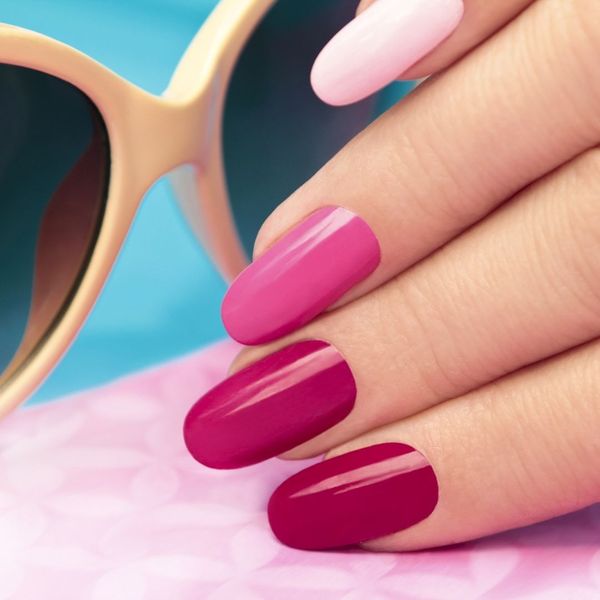 summer nail colors wit hand hear sunglasses and pool