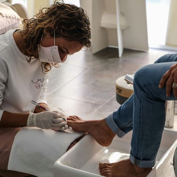 Nail tech working on feet