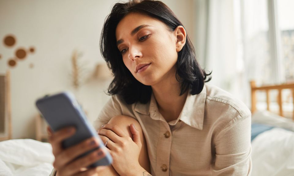woman looking at phone