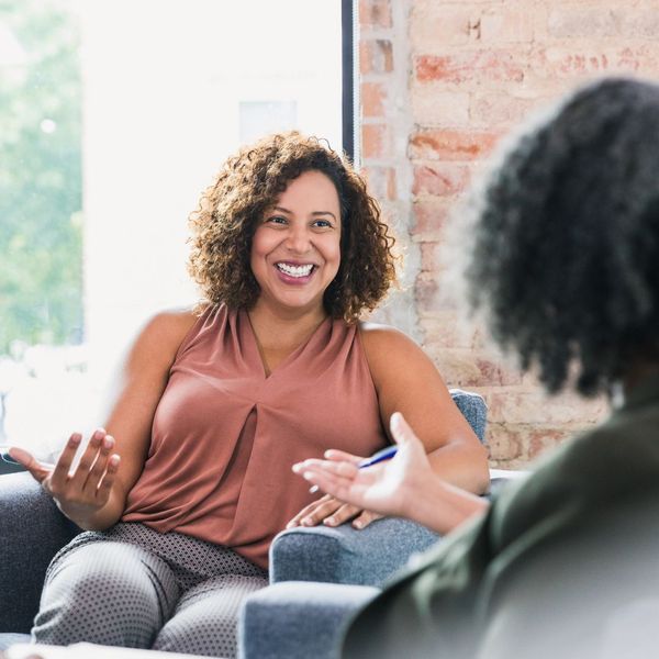 A woman speaking with her speech therapist A woman speaking with her speech therapist