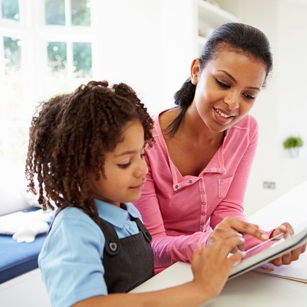 A mother and daughter doing homework together A mother and daughter doing homework together