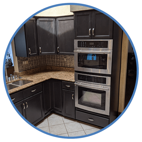 Black Cabinets with silver hardware in kitchen