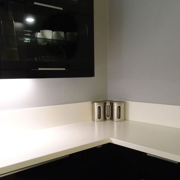Dark cabinet with under cabinet lighting. 