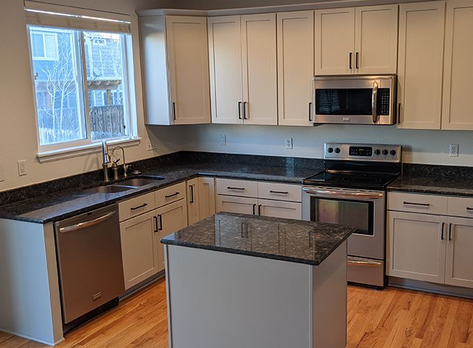 Newly remodeled kitchen with gray cabinets