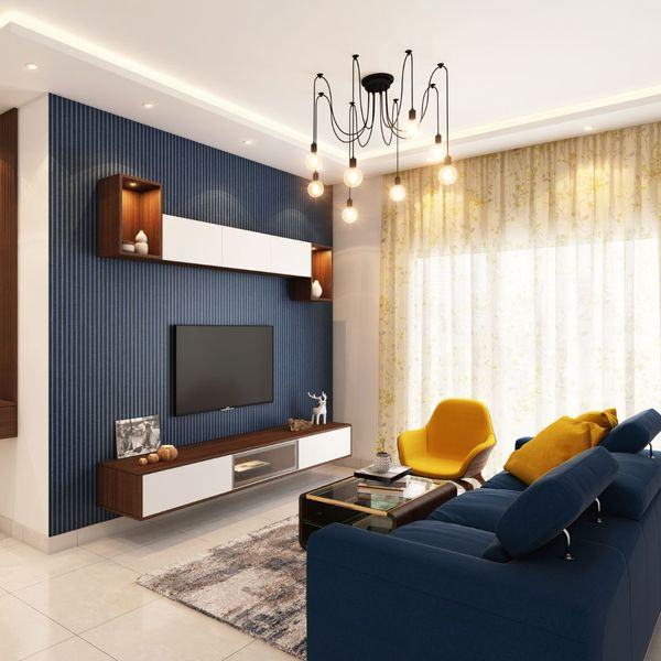 a white living room with royal blue and gold accents