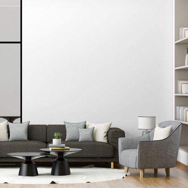 a tall living room with furniture in various shades of grey and black