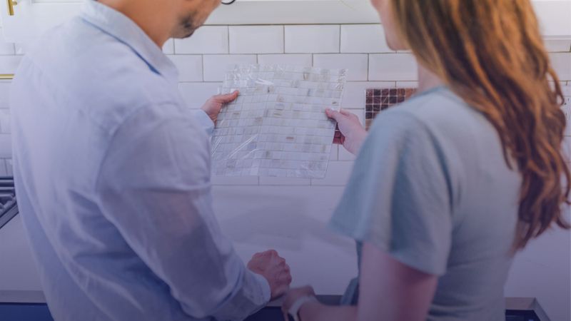 Couple looking at backsplash options