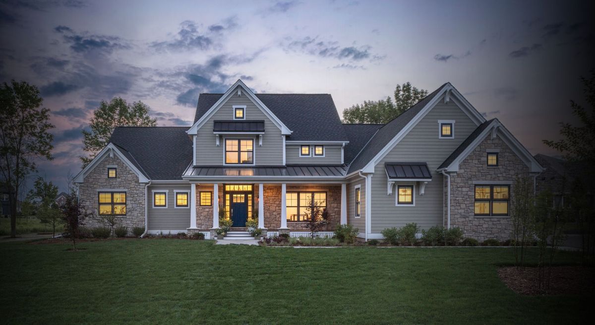 a home with the windows illuminated