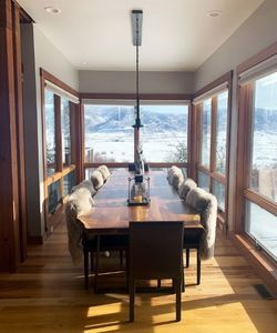 a dining room with big windows