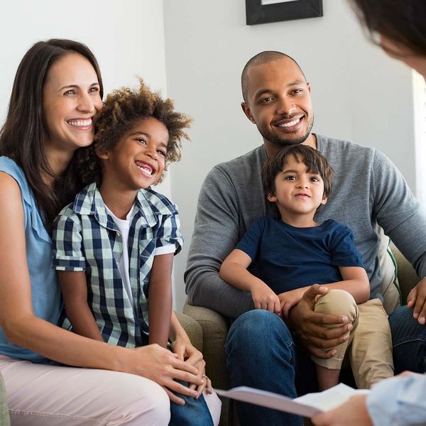 Smiling family discussing resolutions