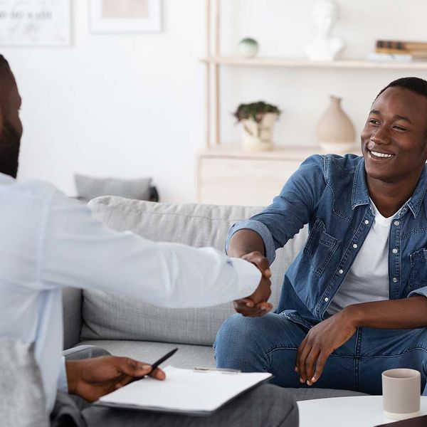 Smiling man meeting with a counselor