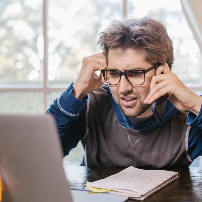 concerned man talking to company about prices for garage door repairs