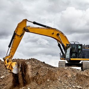 a construction machine scooping dirt