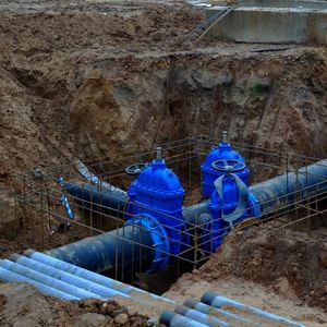 a large water main and pipes being constructed