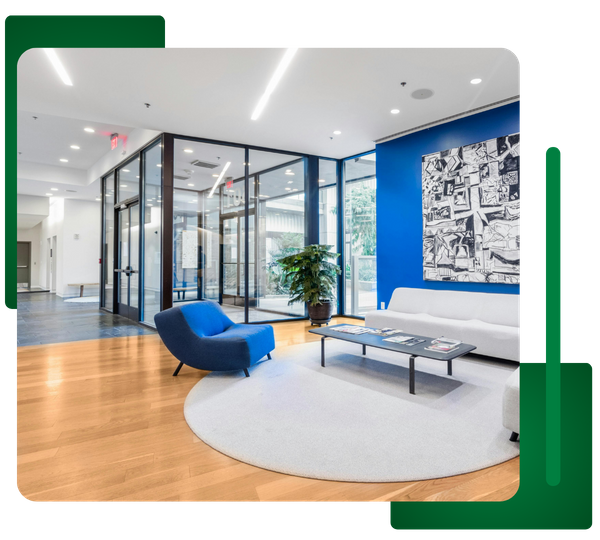 Modern, brightly lit commercial office lobby/waiting area with recessed linear LED lighting.