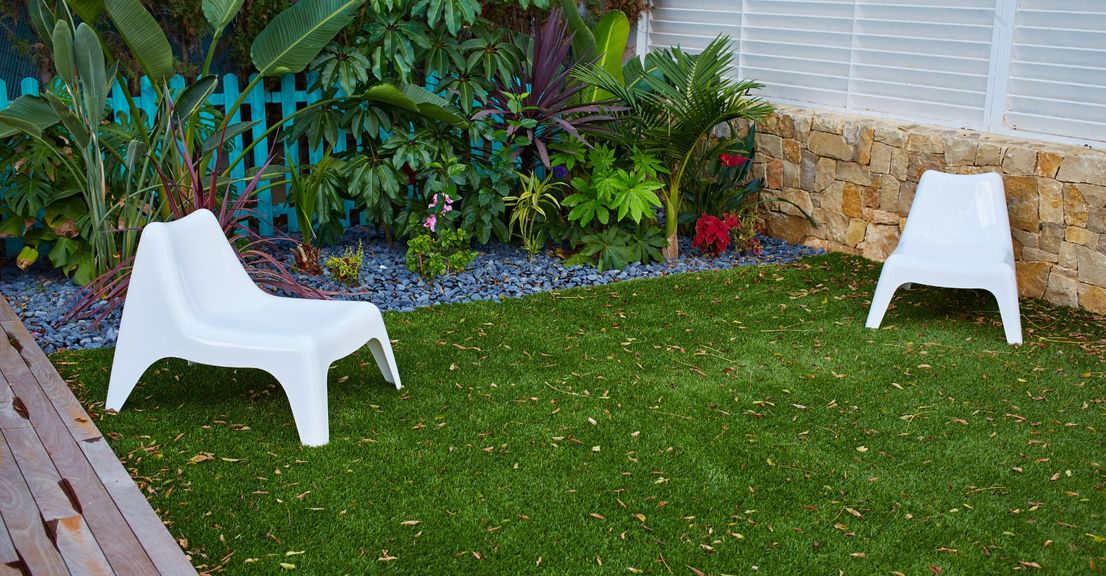 artificial turf with white chairs on top