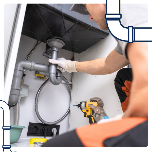 fixing the plumbing for the kitchen sink