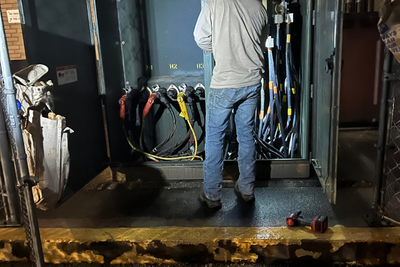man working on electrical panels