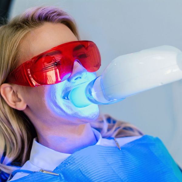 A person going through a teeth whitening treatment