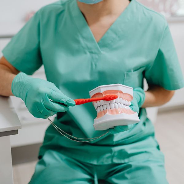 dental hygienist showing a tip