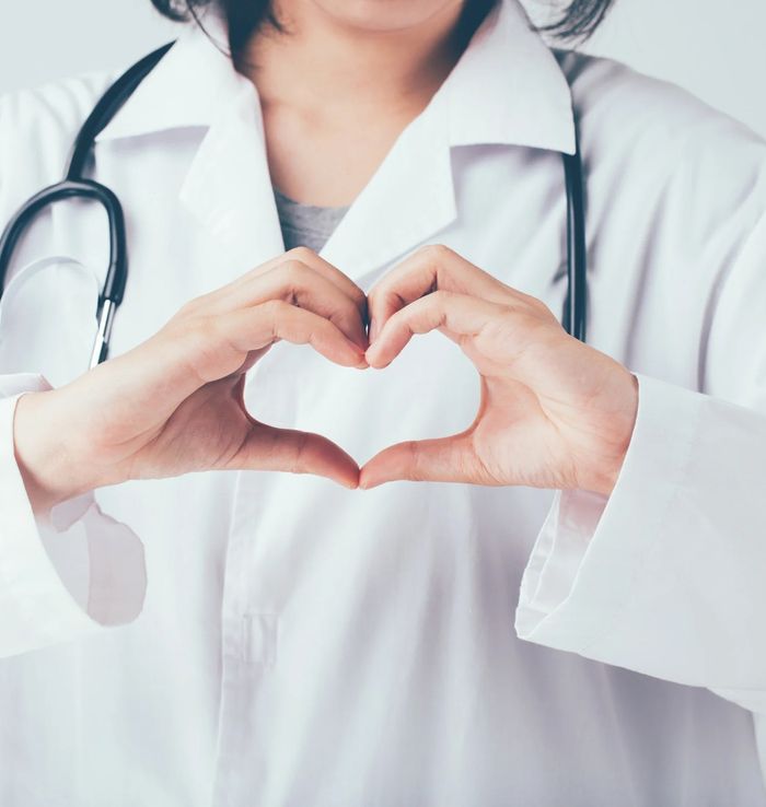 doctor making heart with hands