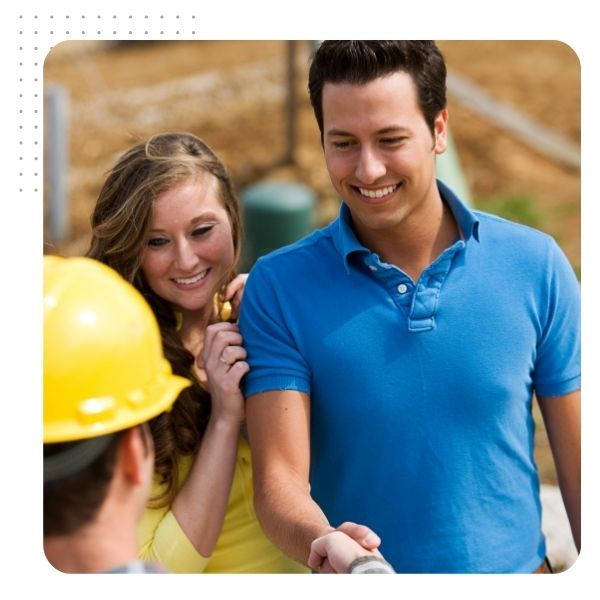 couple shaking hands with contractor couple shaking hands with contractor