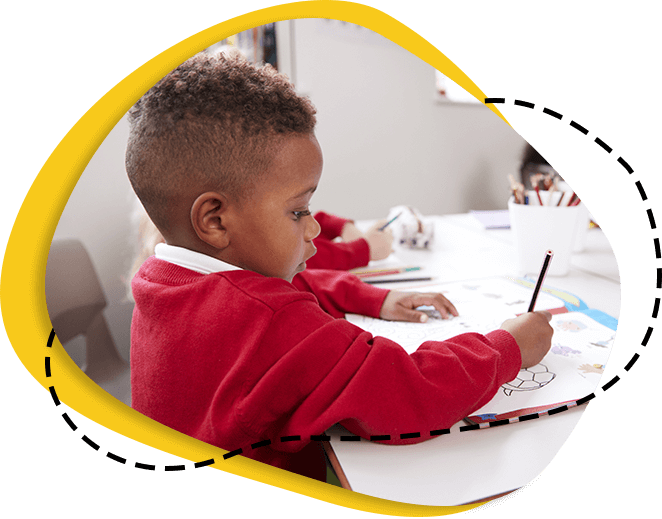 kid writing in classroom