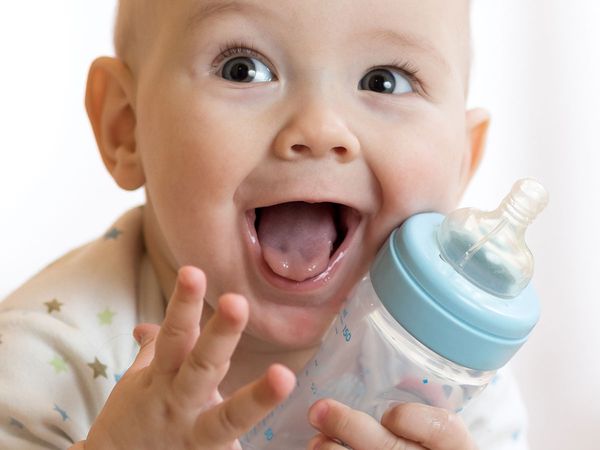 Baby holding a bottle