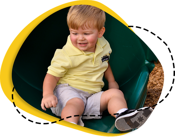 kid playing on slide 