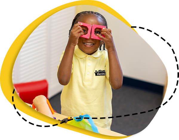 child looking through blocks