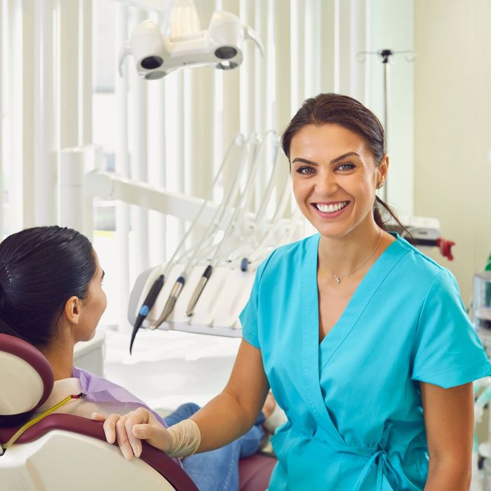 dental assistant with patient