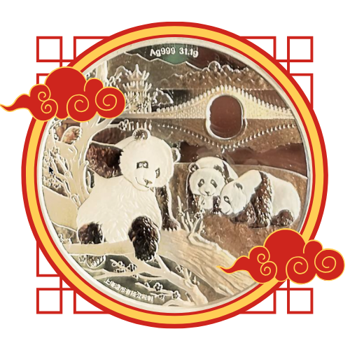 A large silver coin featuring three pandas resting near a tree, with a traditional bridge and pagoda in the background.