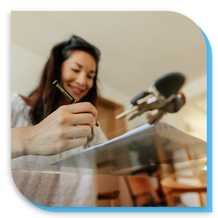 photo of a woman signing a contract