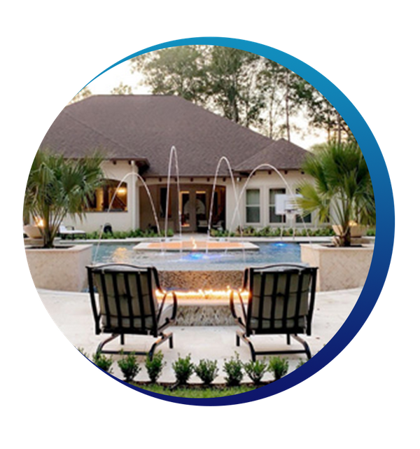 patio chairs sitting in front of firepit and pool with running water fountains