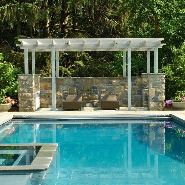 pool with pergola on pool deck