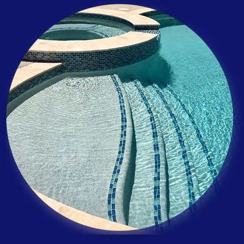 Replastered pool steps and spa with blue tile trim in Houston