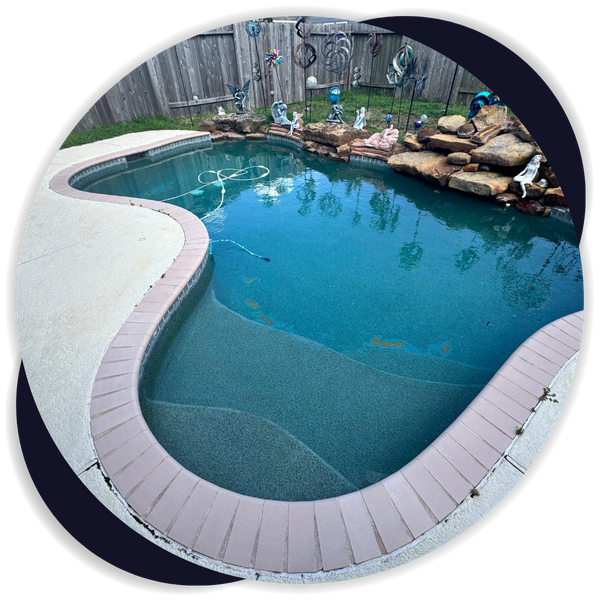 outdoor pool with decorative items surrounding it