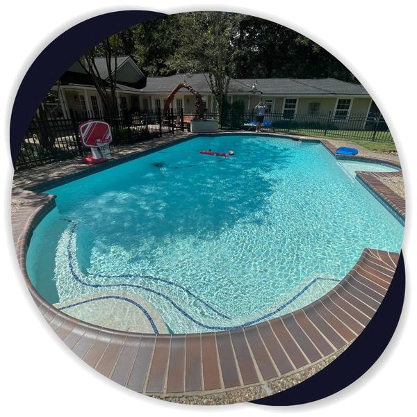 Resurfaced Houston backyard pool with brick coping