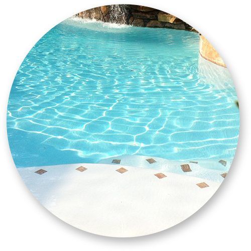 New white plaster beach entry on a Houston pool