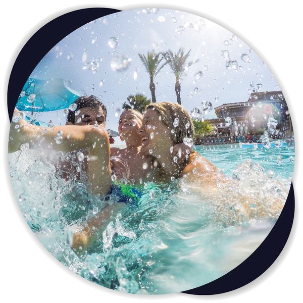 Parents and kid having pool fun